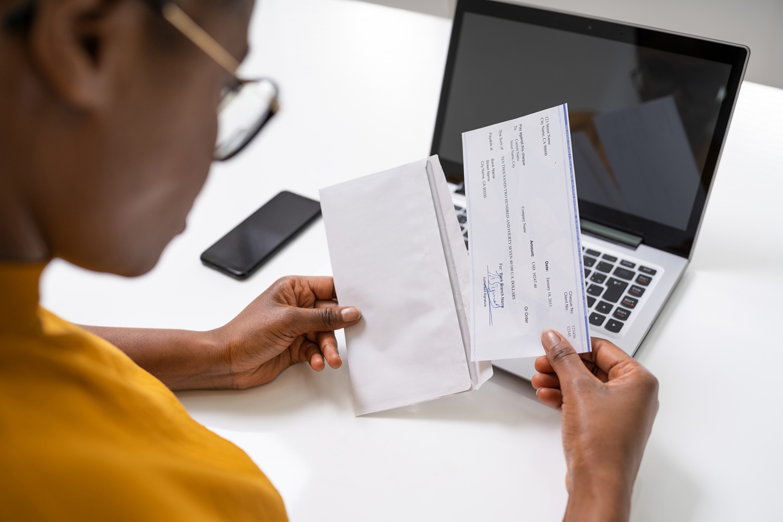 Person looking at paycheck